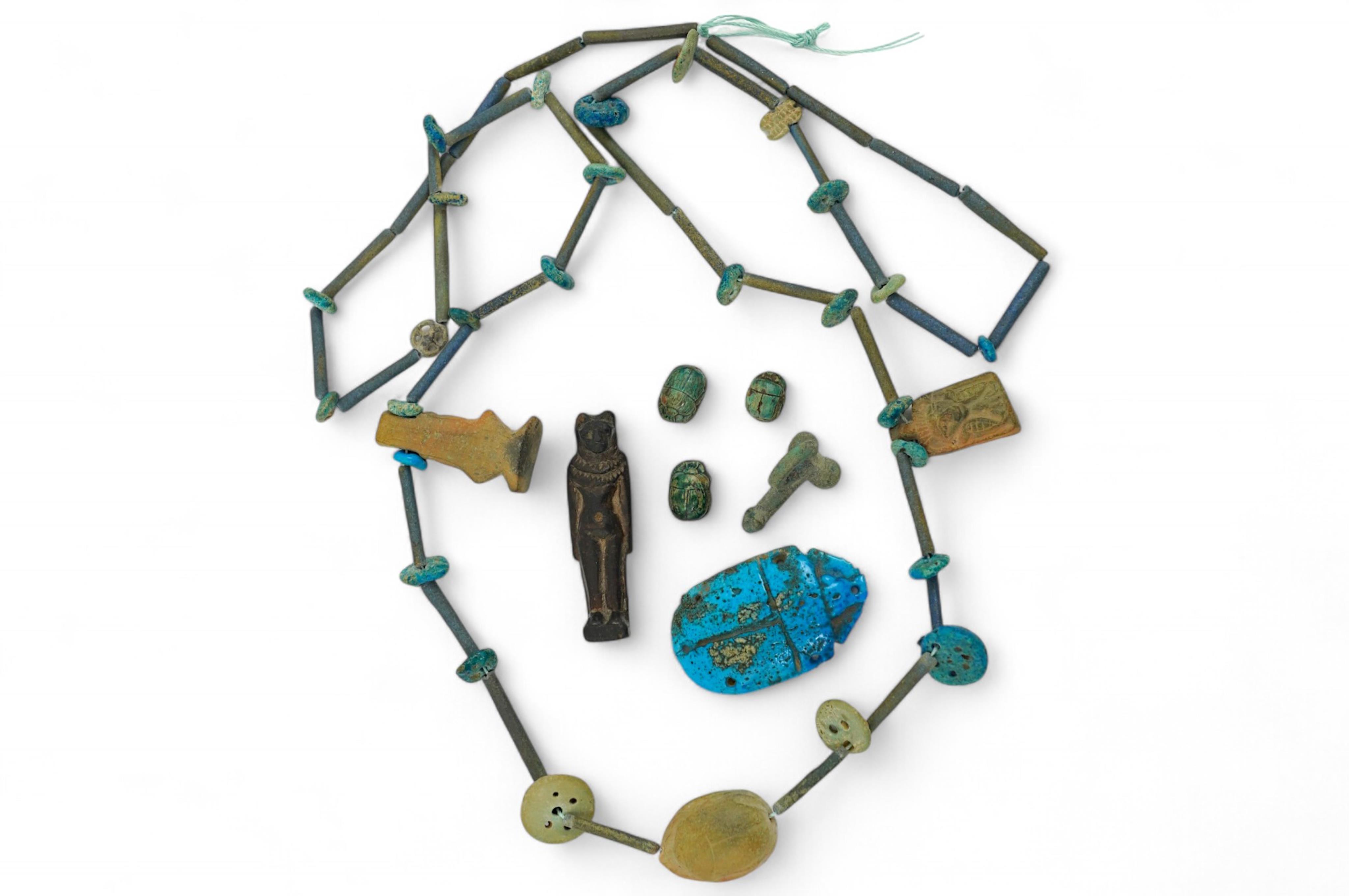 An ancient Egyptian faience necklace, amulets and scarabs, late Kingdom to Ptolemaic period